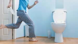 running to the bathroom a man running to the bathroom - pineapples help in Diarrhea